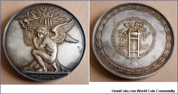 1934 UK Royal Scottish Academy of Painting Sculpture and Architecture Medal by B. Wyon. Silver: 68MM./160 gms.
Obv: Kneeling figure of Mercury supports a platform on which there is a Pegasus & the Eternal Flame. Rev: Laurel branches on tripod, around laurel wreath. Edge: HAROLD O. TARBOLTON. ELECTED ACADEMICIAN MCMXXXIV.
