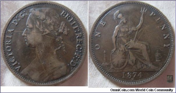 1974H penny. aVF with bad obverse scratches 7+H