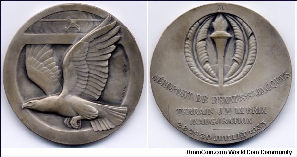 1933 France Aeroport De Rennes Saint Jacques Inauguration Medal by S. GRUN. Silver plated Bronze: 49.6MM.
Obv: Spread Wing Eagle with single engine airplain above. Signed S. GRUN. Rev: Torch in upper front. Legend 80/AEROPORT DE RENNES ST. JACQUES/TERRAIN J.M.LE BRIX/INAUGURATION/28.29.30.JUILLET 1933.
