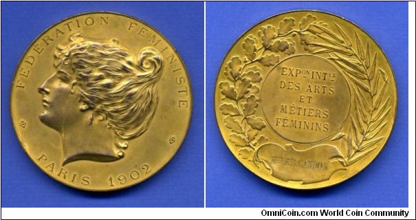 1902 France Exhibition Federation for Feminism Paris Massonnet Medal. Gilted Bronze: 58MM./80 gms. 
Obv.: Bust of French Beauty to right. Legend FEDERATION FEMINISTE, PARIS 1902. Rev.: Wreath surround. Legend EXPon INTle DES ARTS ET METIERS FEMININS. Banner inscribed MRS.GARDON. 
