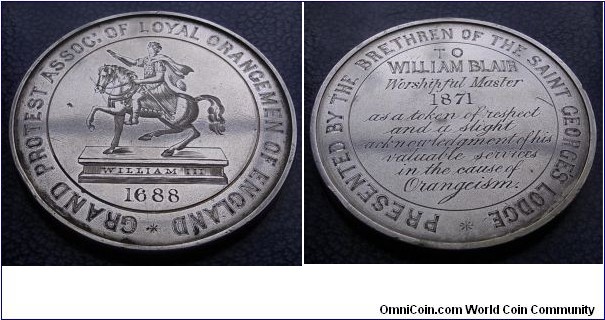 1871 UK William III Grand Protest Assoc: of Loyal Orangemen of England hand engraved Medal. Silver: 65MM./102.8 gms.
Obv: Hand engraved effigy of WilliamIII on Horseback. 1688. Legend GRAND PROTEST ASSOC: OF LOYAL ORANGEMEN OG ENGLAND. Rev: Legend PRESENTED BY THE BRETHREN OF THE SAINT GEORGE'S LODGE & Awarded details in centre TO WILLIAM BLAIR Worshipful Master 1871 as a token of respect and a slight acknowledgment of his valuable services in the cause of Orangeism. 
