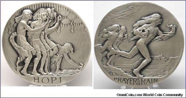 1931 USA, SOM #3 Issue, Hopi Prayer For Rain Oval Medal by H.A.MacNeil. Silver: 70 X 73MM. 7 oz.  Or 213.7 gms. Mintage: 25.
Obv: 5 Hopi Indian dancers enacing the prayer for rain, 2 with venomous snakes in their mouths, under stylized clouds, reminiscent of Native sand art printing. H.A MacNeil inscribed on the bottom right. Rev: A dynamic design of dancers running to return the snakes to their dens as the lightning and rain begin.
