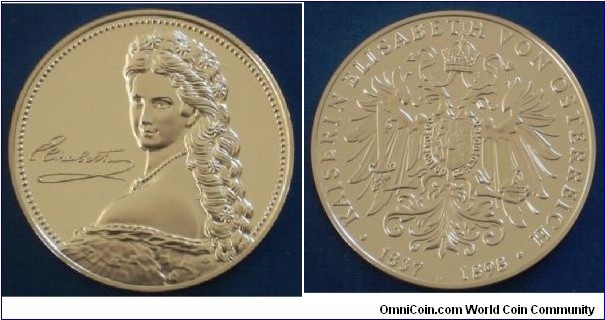 1990 o j Austria Empress Elisabeth of Austria Medal. Gilted Silver: 40MM./30 gms. 
Obv: Protrait of Elizabeth to left with her signature. Rev: Coat of Arm of Austria Empire. Legend KAISERIN ELISABETH VON OSTERREIGH. 1837 1898.
