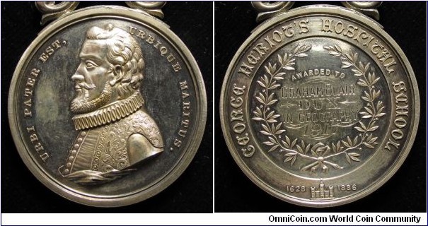 1917 UK George Heriots School (Scotland) Medal strunk by Kirkwood & Son. Silver: 48MM,/55.2 grs.
Obv: Bust of School founder George Heriot in ancient dress to left. Legend URBI PATER EST. ERBIQUE MARITUS. Rev: Awarded to Graham Blair DUX IN GEORGRAPHY 1917 surround by wreath in center. Legend GEORGE HERIOT'S HOSRITAL SCHOOL. Symbol of  School Building between 1628.1886.
