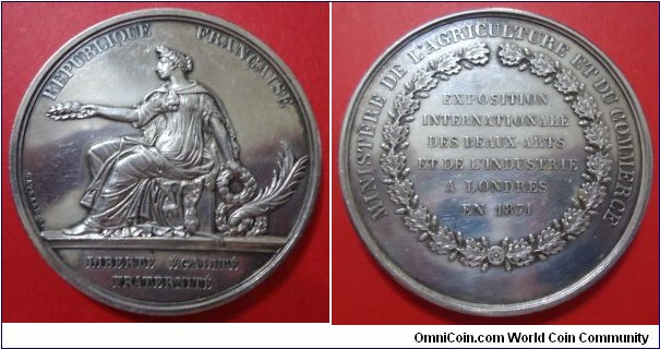 1871 France Exposition Internationale Des Beaux Arts Et De L'Industrie A Londre Medal by Gayrard. Silver 65 gms.
Obv: Female seated with wreath in both hand. Legend REPUBLIQUE FRANCAISE. Signed GAYRARD F.  Exergue L'IBERGE EGALITE FRATERNITE. Rev: EXPOSITION/INTERNATIONALE/DES BEAUX ARTS/ET DE L'INDUSTRIE/A LONDRES/EN 1871 surround by wreath. Legend MINISTERE DE L,AGRICULTURE ET DU COMMERCE.
