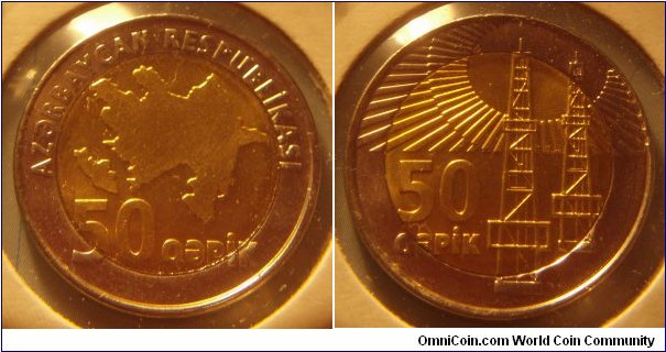 Azerbaijan |
50 Qəpik, ND (2006) |
25.5 mm, 7.7 gr. |
Bi-Metallic: Brass plated Steel centre in Stainless Steel ring |

Obverse: Map of Azerbaijan, denomination below |
Lettering: AZƏRBAYCAN RESPUBLİKASI 50 QƏPİK |

Reverse: Two oil wells, denomination left |
Lettering: 50 QƏPİK |