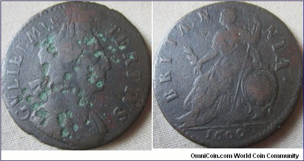 1699 halfpenny, well struck missing upper bar of E in GVLIELMVS, bad pitting on obverse but good clear and crisp details