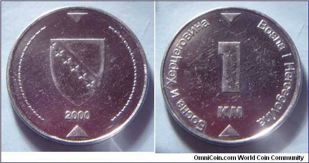 Bosnia and Herzegovina | 
1 Konvertibilna Marka, 2000 | 
23.23 mm, 4.95 gr. | 
Nickel plated Steel | 

Obverse: National Coat of Arms, date below | 
Lettering: 2000 | 

Reverse: Denomination | 
Lettering: Босна и Херцговина Bosna i Hercegovina 1 KM |