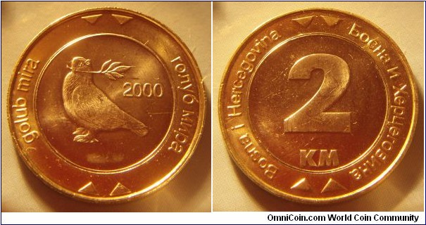 Bosnia and Herzegovina | 
2 Konvertibilna Marka, 2000 | 
25.75 mm, 6.9 gr. | 
Bi-Metallic: Copper-nickel centre in Nickel-brass ring | 

Obverse: Dove of Peace, date right | 
Lettering: golub mira голуб мира 2000 | 

Reverse: Denomination | 
Lettering: Bosna i Hercegovina Босна и Херцговина 2 KM |