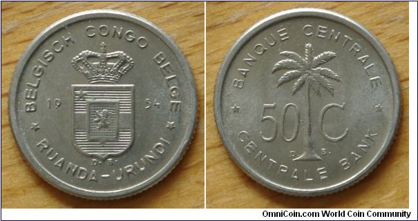 Ruanda-Urundi | 
50 Centimes, 1954 | 
18mm, 0.67 gr. | 
Aluminium | 

Obverse: Crowned Coat of Arms divide date | 
Lettering: * BELGISCH CONGO BELGE * 16 54 RUANDA-URUNDI  | 

Reverse: Oil Palm Tree divide denomination | 
Lettering: * BANQUE CENTRALE * 50 C CENTRALE BANK |