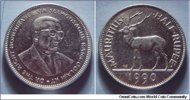 Mauritius | 
½ Rupee, 1990 | 
23 mm, 6 gr. | 
Nickel plated Steel | 

Obverse: Sir Seewoosagur Ramgoolam facing right | 
Lettering: * DR THE RIGHT HONOURABLE SIR SEEWOOSAGUR RAMGOOLAM KT | 

Reverse: Stag facing left, denomination right, date below | 
Lettering: •MAURITIUS• •HALF•RUPEE• 1990 |