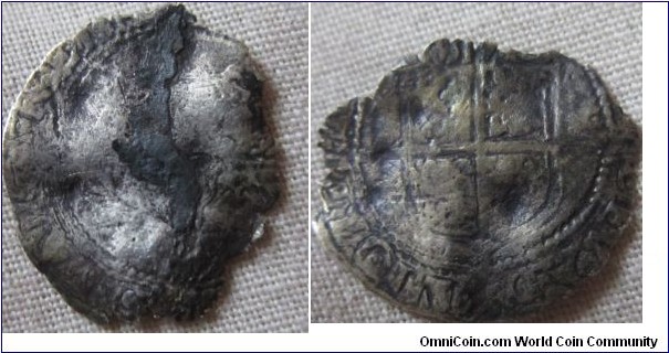badly worn and damaged threefarthings of Elizabeth I dated 15 somthing