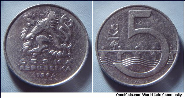 Czech Republic | 
5 Korun, 1994 | 
23 mm, 4.8 gr. | 
Nickel plated Steel |  

Obverse: Czech Lion, date below | 
Lettering: ČESKÁ REPUBLIKA 1994 | 

Reverse: Linden leaf and Charles Bridge over Vltava (Moldau) river, denomination right | 
Lettering: Kč 5 |