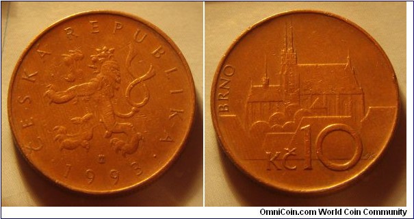 Czech Republic | 
10 Korun, 1993 | 
24.5 mm, 7.62 gr. | 
Copper plated Steel |  

Obverse: Czech Lion, date below | 
Lettering: • ČESKÁ REPUBLIKA • 1993 | 

Reverse: Petrov national monument in Brno, denomination below | 
Lettering: BRNO Kč 10 |