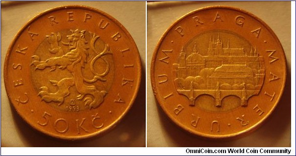 Czech Republic | 
50 Korun, 1993 | 
27.5 mm, 9.7 gr. | 
Bi-Mettalic: Brass plated Steel centre in Copper plated Steel ring |  

Obverse: Czech Lion, date below, denomination bottom | 
Lettering: • ČESKÁ REPUBLIKA • 50 Kč 1993 | 

Reverse: View of Prague with Charles Bridge, St. Vitus's Cathedral | 
Lettering: • URBINUM • PRAGA • MATER |