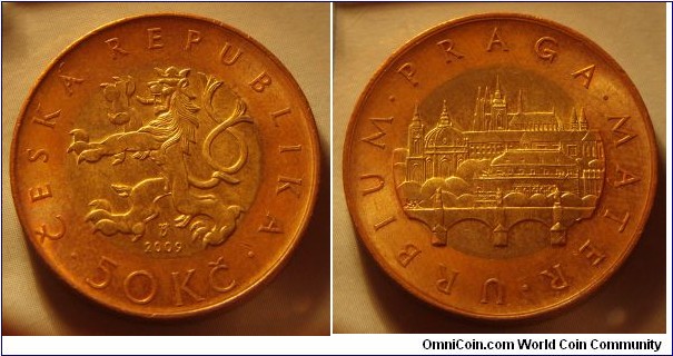 Czech Republic | 
50 Korun, 2009 | 
27.5 mm, 9.7 gr. | 
Bi-Mettalic: Brass plated Steel centre in Copper plated Steel ring |  

Obverse: Czech Lion, date below, denomination bottom | 
Lettering: • ČESKÁ REPUBLIKA • 50 Kč 2009 | 

Reverse: View of Prague with Charles Bridge, St. Vitus's Cathedral | 
Lettering: • URBINUM • PRAGA • MATER |