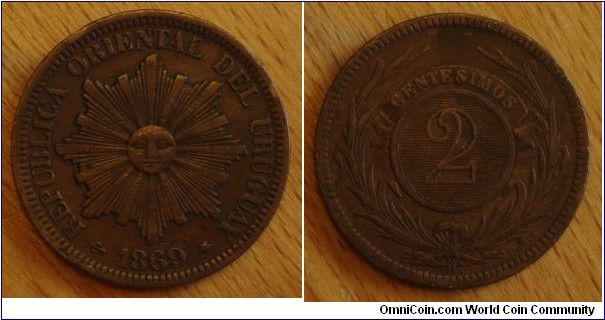 Uruguay | 
2 Centésimos, 1896 H | 
30 mm, 10 gr. | 
Bronze | 

Obverse: Sun with rays, date below | 
Lettering: REPUBLICA ORIENTAL DEL URUGUAY | 

Reverse: Laurel wreath, denomintaion above| 
Lettering: CENTESIMOS 2 H |