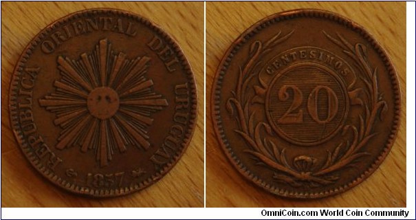 Uruguay | 
20 Centésimos, 1857 | 
34 mm, 21.3 gr. | 
Copper | 

Obverse: Sun with rays, date below | 
Lettering: REPUBLICA ORIENTAL DEL URUGUAY | 

Reverse: Laurel wreath, denomintaion above| 
Lettering: CENTESIMOS 20 D |