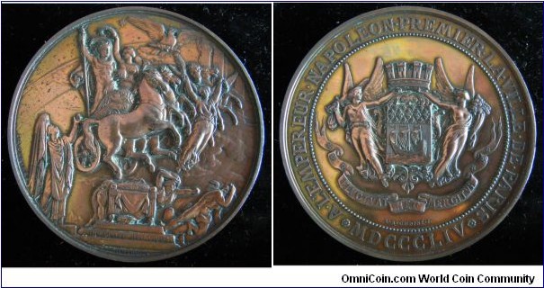 1854 France Apotheosis of Napoleon I (1804-1854) 50th Anniversary Coronation Medal by Eugene Andre Oudine. Silver plated Bronze: 78MM.
Obv: Apotheosis of Napoleon, Napoleon rising in Quadriga crowned with Fame ner the Rainbow. Signed E.A. OUDINE. On step legend IN NEPOTE REDIVIVUS/INGRES PINXIT (in the Nephew we return to life). Rev:  Paris' Armories, shield of City of Paris, supported by two Fames with a Crown above. Banner ELVCTVAT NEC MERGITVE. Signed E.A. OUDINE.F. Legend A.L'EMPEREUR.NAPOLEON.PREMIER.LA.VILLA.DE PARIS. MDCCCLIV. 
