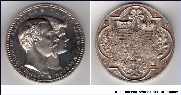 1882 UK Marriage of the Duke of Albany and Princess Helen of Waldeck Medal by J.S. & A.B. Wyon. Silver: 64MM./154.88 gms.
Obv: Conjoined busts of the Duke & Princess right. Legend LEOPOLD DUKE OF ALBANY.K.G*PRINCESS HELEN OF WALDECK*. Signed J.S. & A.B.WYON. Rev: Crowned arms of the Duke & Princess on entwined leaves of oak and rosemary within a qua trefoil and board of roses. 27 APRIL, 1882.
