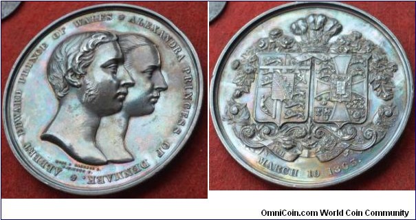 1863 UK Marriage of Prince of Wales to Princess Alexandra Medal by Leonard Charles Wyon.  Silver: 64MM.
Obv: Conjoined heads right. Legend ALBERT EDWARD PRINCE OF WALES * ALEXANDRA PRINCESS OF DENMARK.* Signed L.C. WYON F.  Rev: Prince of Wales plumes over garlanded shield of arms. MARCH 10 1863. 
