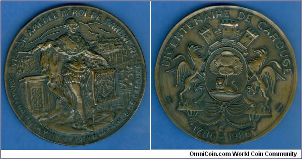 1986 France Bicentenaire de Carouge Medal. Bronze: 70MM./143.45 gm.
Obv: Coats of Arms of Carouge. Legend BICENTENAIRE DE CAROUGE 1786-1986. Rev: Victor Amedee III stnads with rope, scene of Province De Carouge behind. Legend VICTOR AMEDEE III ROI DE SARDAIGN. FOUDATEUR DE LA VILLE ET DE LA PROVINCE DE CAROUGE.
