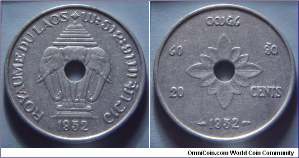 French Laos | 
20 Cents, 1952 | 
27 mm, 2.23 gr. | 
Aluminium | 

Obverse: National Coat of Arms, date below | 
Lettering: ROYAUME DU LAOS ພະຣາຊະອານາຈັກລາວ | 

Reverse: Flower surrounding centre hole, denomination in Lao and French, date below | 
Lettering: ໑໙໕໒ ໒໐ ອັດ 20 CENTS 1952 |