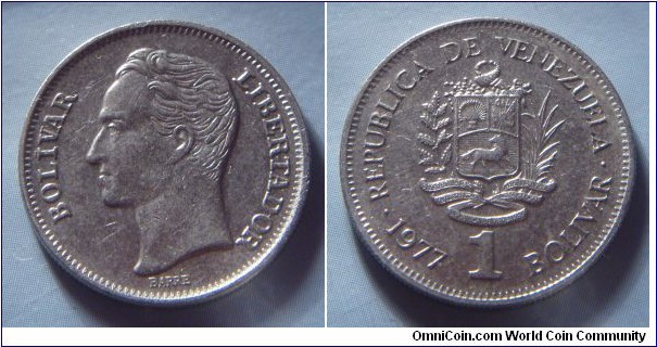 Venezuela | 
1 Bolívar, 1977 | 
23 mm, 5 gr. | 
Nickel | 

Obverse: Simón Bolívar facing left | 
Lettering: BOLÍVAR LIBERTADOR | 

Reverse: National Coat of Arms, date and denomination below | 
Lettering: • REPUBLICA DE VENEZUELA • 1977 1 BOLIVAR | 