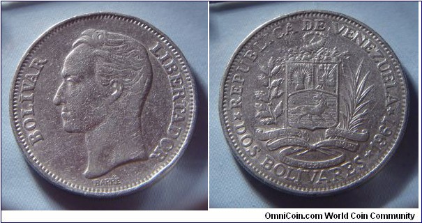 Venezuela | 
2 Bolívares, 1967 | 
27 mm, 8.6 gr. | 
Nickel | 

Obverse: Simón Bolívar facing left | 
Lettering: BOLÍVAR LIBERTADOR | 

Reverse: National Coat of Arms, date and denomination below | 
Lettering: * REPÚBLICA DE VENEZUELA * DOS BOLÍVARES * 1967 |