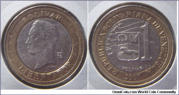 Venezuela | 
1 Bolívar, 2007 | 
24 mm, 8.04 gr. | 
Bi-metallic: Copper-nickel centre in Aluminium-bronze ring | 

Obverse: Simón Bolívar facing left, date below | 
Lettering: BOLÍVAR LIBERTADOR | 

Reverse: National coat of arms, denomination below, date bottom | 
Lettering: REPÚBLICA BOLIVARIANA DE VENEZUELA 2007 ******** 1 BOLÍVAR |