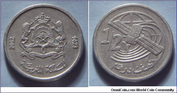 Morocco | 
½ Dirham, 2002 (1423) | 
21 mm, 4 gr. | 
Copper-nickel | 

Obverse: National Coat of Arms | 
Lettering: 2002 1423المملكة المغربية |

Reverse: Satellite, denomination left | 
Lettering: ½ نصف درهم |