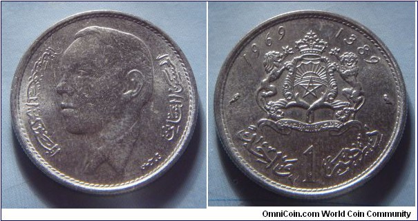 Morocco | 
1 Dirham, 1969 (1389) | 
24 mm, 6 gr. | 
Nickel | 

Obverse: King Hassan II facing left | 
Lettering: المملكة المغربية الحسن الثاني |

Reverse: National Coat of Arms, date above, denomination below | 
Lettering: 1969 1384 درهما 1 واحد |