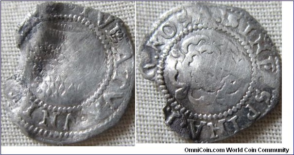James I hammered penny worn, buckled with a piece missing but still great detail.