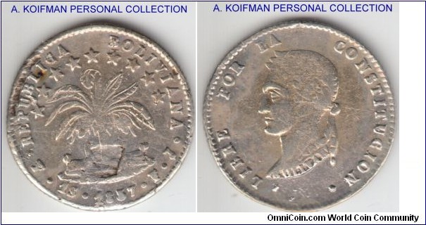 KM-119.2, 1857 Bolivia sol, Potosi mint (PTS mintmark in monogram); silver, reeded edge; dot after CONSTITUCION variety, very fine or so, typically crudely struck, die breaks, lamination, filled letters and a bad flan or struck through on obverse.