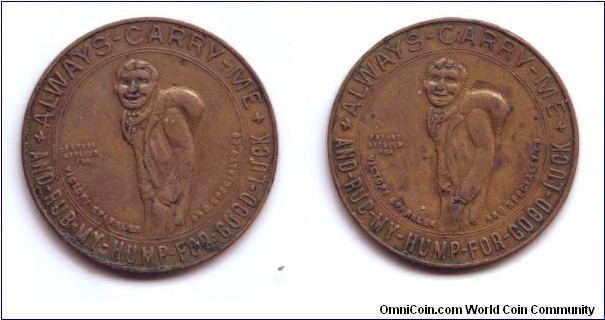 This coin, produced by the Victory Sparkler and Specialty Company of Baltimore, shows the Gobbo - a well dressed hunchback whose hump it is lucky to rub.