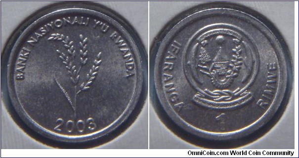 Rwanda | 
1 Franc, 2003 | 
16 mm, 0.7 gr. | 
Aluminum | 

Obverse: Mature rice plant, date below | 
Lettering: BANKI NASIYONALI Y'U RWANDA 2003 | 

Reverse: National Coat of Arms, denomination above | 
Lettering: IFARANGA 1 RIMWE |