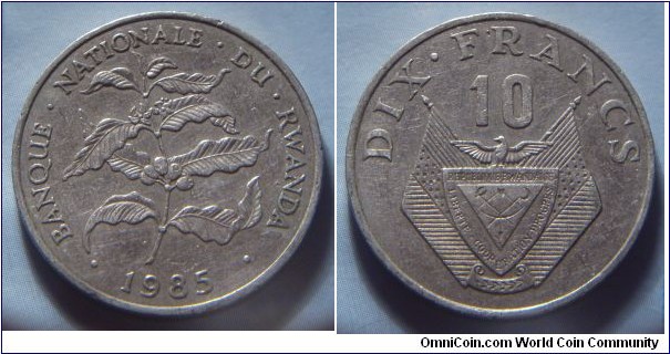 Rwanda | 
10 Francs, 1985 | 
26.5 mm, 7 gr. | 
Copper-nickel | 

Obverse: Plant, date below | 
Lettering: • BANQUE • NATIONALE • DU • RWANDA • 1985 | 

Reverse: National Coat of Arms, denomination above | 
Lettering: DIX • FRANCS 10 |