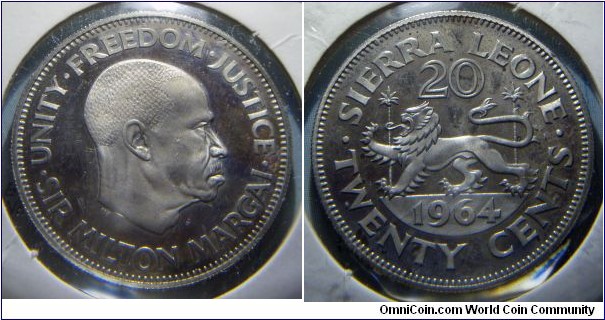 Sierra Leone | 
20 Cents, 1964 | 
26.95 mm, 8.25 gr. | 
Copper-nickel | 

Obverse: Sir Milton Margai facing right | 
Lettering: UNITY•FREEDOM•JUSTICE•SIR MILTON MARGAI• | 

Reverse: Part of Coat of Arms, denomination above, date below | 
Lettering: SIERRA LEONE • TWENTY CENTS • 20 1964 |