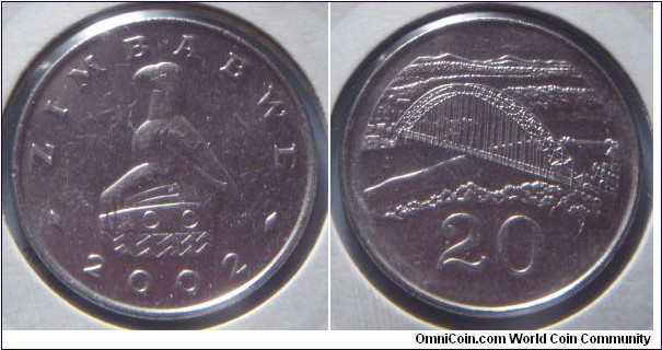 Zimbabwe | 
20 Cents, 2002 | 
23 mm, 5.5 gr. | 
Nickel plated Steel | 

Obverse: National Coat of Arms, date below | 
Lettering: ZIMBABWE 2002 | 

Reverse: Birchenough bridge over the Sabi River, denomination below | 
Lettering: 20 |