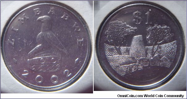 Zimbabwe | 
1 Dollar, 2002 | 
29 mm, 10.1 gr. | 
Stainless Steel | 

Obverse: National Coat of Arms, date below | 
Lettering: ZIMBABWE 2002 | 

Reverse: Zimbabwe Ruins, denomination above | 
Lettering: $1 |