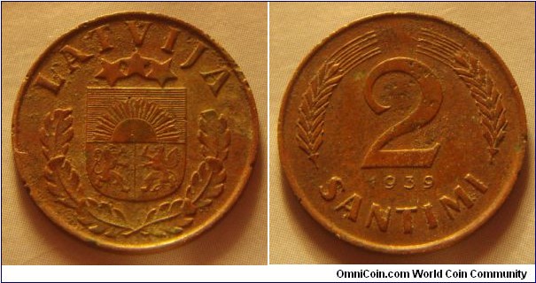 Latvia | 
2 Santīmi, 1939 | 
19.5 mm, 2 gr. | 
Bronze | 

Obverse: National Coat of Arms | 
Lettering: LATVIJA | 

Reverse: Denomination, date below | 
Lettering: 2 Santimi 1939 |