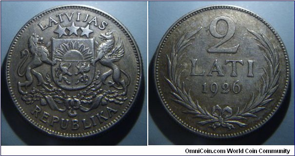 Latvia | 
2 Lati, 1926 | 
27 mm, 10 gr. | 
Silver (.835) | 

Obverse: National Coat of Arms | 
Lettering: LATVIJAS REPUBLIKA | 

Reverse: Denomination and date within wreath | 
Lettering: 2 LATI 1926 |