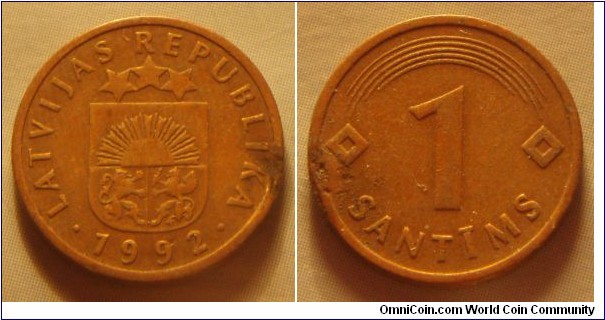 Latvia | 
1 Santīms, 1992 | 
15.65 mm, 1.6 gr. | 
Copper-clad Steel | 

Obverse: Small Coat of Arms, date below | 
Lettering: • LATVIJAS REPUBLIKA • 1992 | 

Reverse: Denomination | 
Lettering: 1 SANTĪMS |