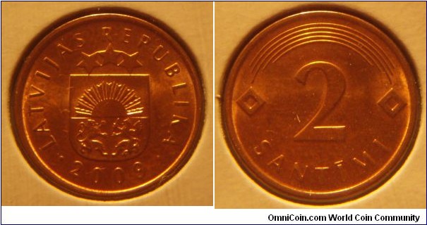 Latvia | 
2 Santīmi, 2009 | 
17 mm, 1.9 gr. | 
Copper-clad Steel | 

Obverse: Small Coat of Arms, date below | 
Lettering: • LATVIJAS REPUBLIKA • 2009 | 

Reverse: Denomination | 
Lettering: 2 SANTĪMI |