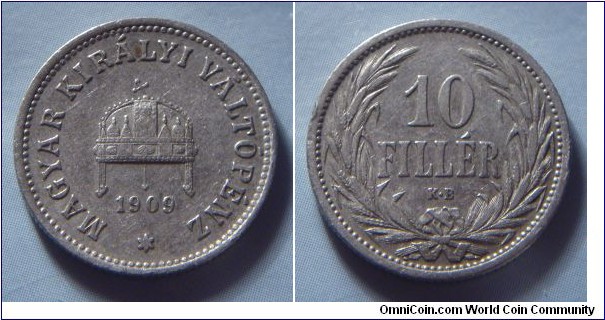 Kingdom of Hungary | 
10 Fillér, 1909 | 
19 mm, 3 gr. | 
Nickel | 

Obverse: Crown with crooked cross, date below | 
Lettering: * MAGYAR KIRÁLYI VÁLTÓPÉNZ 1909 | 

Reverse: Denomination within wreath | 
Lettering: 10 FILLÉR |