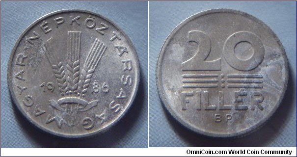 Hungarian People's Republic | 
20 Fillér, 1986 | 
20.3 mm, 0.95 gr. | 
Aluminium | 

Obverse: Three wheat stalks divides date | 
Lettering: • MAGYAR • NÉPKÖZTÁRSASÁG 1986 | 

Reverse: Denomination | 
Lettering: 20 FILLÉR |