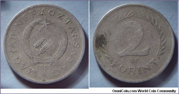 Hungarian People's Republic | 
2 Forint, 1950 | 
24.8 mm, 4.9 gr. | 
Copper-nickel | 

Obverse: Socialist Coat of Arms, date below | 
Lettering: MAGYAR • NÉPKÖZTÁRSASÁG 1950 | 

Reverse: Denomination | 
Lettering: 2 FORINT |