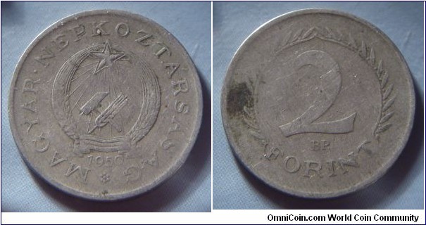 Hungarian People's Republic | 
2 Forint, 1950 | 
24.8 mm, 4.9 gr. | 
Copper-nickel | 

Obverse: Socialist Coat of Arms, date below | 
Lettering: MAGYAR • NÉPKÖZTÁRSASÁG 1950 | 

Reverse: Denomination | 
Lettering: 2 FORINT |
