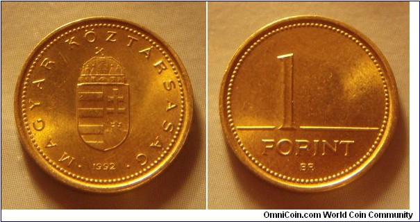 Hungary | 
1 Forint, 1992 | 
16.3 mm, 2.05 gr. | 
Nickel-brass | 

Obverse: National Coat of Arms, date below | 
Lettering: • MAGYAR KÖZTÁRSASÁG • 1992 | 

Reverse: Denomination | 
Lettering: 1 FORINT |