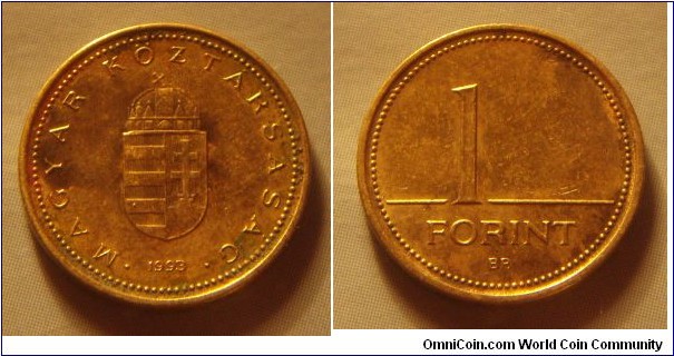 Hungary | 
1 Forint, 1993 | 
16.3 mm, 2.05 gr. | 
Nickel-brass | 

Obverse: National Coat of Arms, date below | 
Lettering: • MAGYAR KÖZTÁRSASÁG • 1993 | 

Reverse: Denomination | 
Lettering: 1 FORINT |